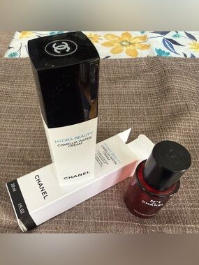 EMPTY CHANEL Hydra Beauty Camellia Water Cream and Chanel serum bottles